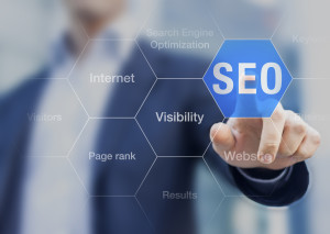 Search Engine Optimization consultant touching SEO button on whi