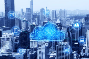 Cloud computing concept illustration showing an image of a cloud over a city.