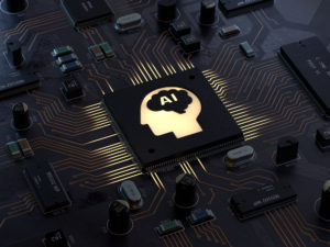 Circuit board with lit up outline of human head in profile with "AI" written on it, as an illustration for artificial intelligence.