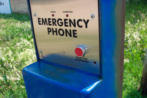 Close up of a blue emergency phone.