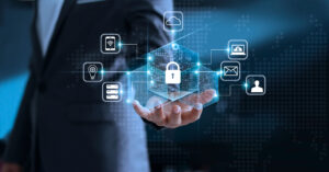 A person in a suit holds their left hand out palm up. A padlock and other security-related icons hover over their hand.